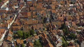 Aerial view of the city Villingen-Schweningen in Germany in the black forest on a sunny day in summer. Pan to the right along the old town.