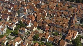 Aerial view of the city Villingen-Schweningen in Germany in the black forest on a sunny day in summer. Pan to the right above the old town.