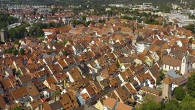 Aerial view of the city Villingen-Schweningen in Germany in the black forest on a sunny day in summer. Pan to the right beside the old town.