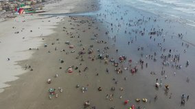 Drone video from Clifton Beach in Karachi, Pakistan during the Independence Day of Pakistan (Big group of people at the beach)