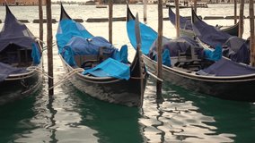 4k video of Gondola boat in Venice, Italy. Venetian famous touristic symbol