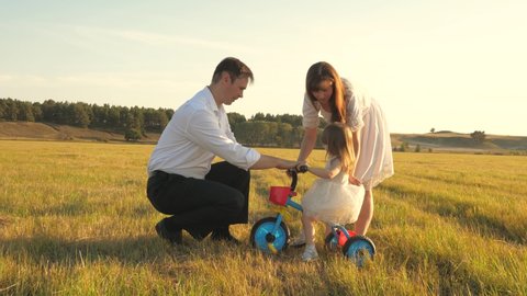 Dad Mom Teach Daughter Ride Bike Stock Footage Video (100% Royalty-free