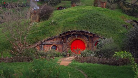 Hobbiton, New Zealand; 2019: Red Hobbit Hole under the green hill