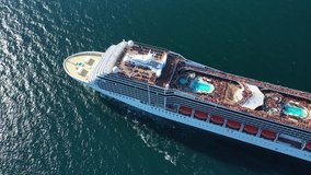 Aerial video of large cruise liner ship cruising deep open ocean sea