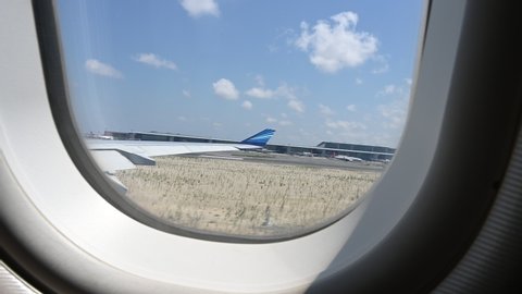 ISTANBUL, TURKEY - JULY, 2019: Window view take off from Istanbul new airport with Azerbaijan Airbus A340-500. 