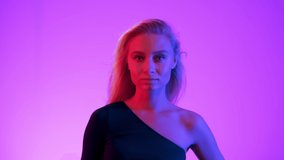 Vivid neon style light. Young blond woman putting up black sunglasses on pink rose gradient background. Close up of attractive fashion model smiles looking at camera lens - Powered by Shutterstock - Get 15% off with code: PIKWIZARD15