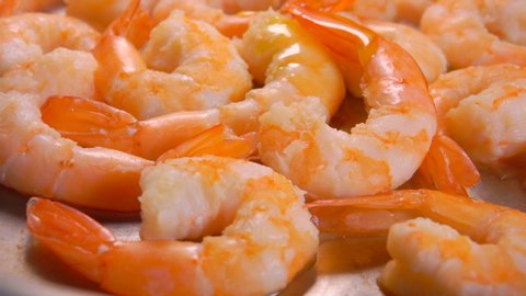Delicious shrimps are sprinkled with olive oil in a pan. Shrimp Recipe
