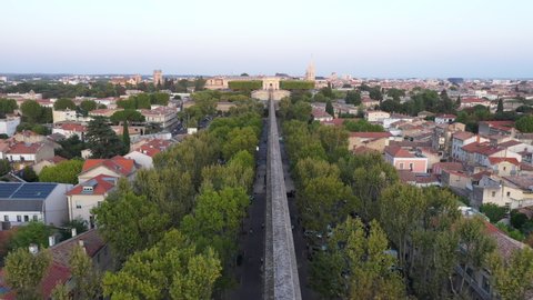 Aerial view over the aqueduct of Montpellier with Peyrou park in background France plane trees 