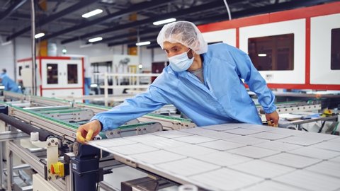 VINNITSA, UKRAINE - September 2019:  Special machines make solar panel. Working factory mechanism of solar cells distribution