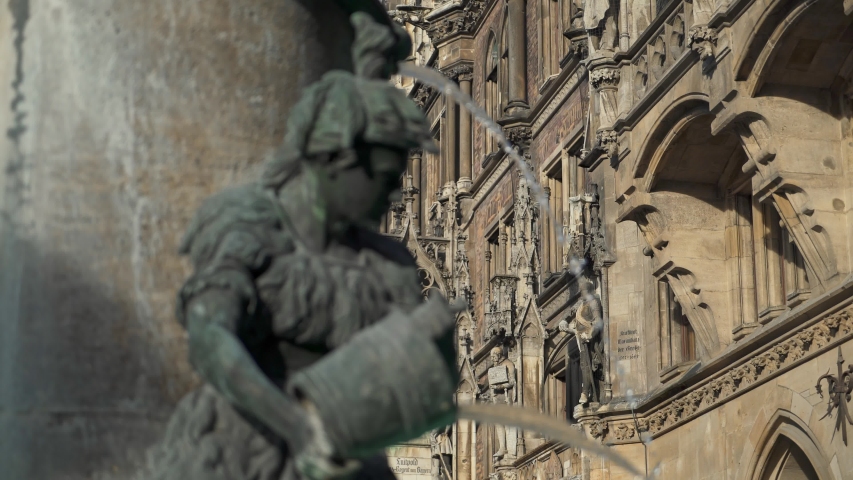 Real time medium shot of the Figure of a boy on the famous fish fountain on the Marienplatz in Munich, November 27, 2019 in Munich, Germany.