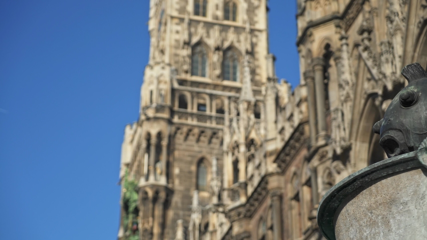 Left to right pan real time medium shot of the figure of the fish on the famous fish fountain on the Marienplatz in Munich, November 27, 2019 in Munich, Germany.