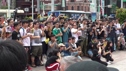 TAIPEI, TAIWAN - 18 AUGUST 2019 : “AKB48 Team TP” fans enjoying the dance and song performance at the street near Ximen shopping district. The sister group of the Japanese idol girl group AKB48.