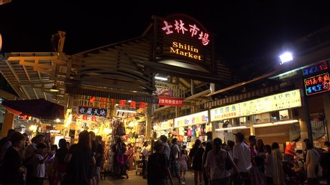 TAIPEI, TAIWAN - CIRCA AUGUST 2019 : Scenery of SHILIN NIGHT MARKET. Many kind of shops, vendors and stalls of food, clothes, souvenir and game machine at the market.