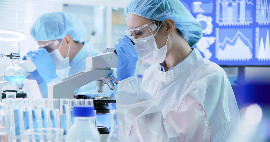 Asian scientist team take petri dish in the laboratory | Shutterstock HD Video #1038347702