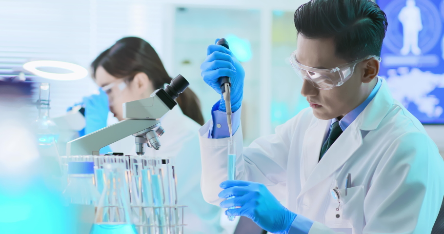 asian scientist team take test tube in the laboratory Royalty-Free Stock Footage #1038347741