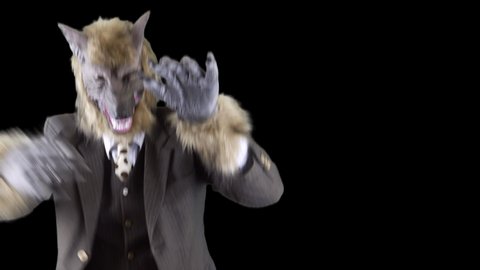 A werewolf dances the night away this Halloween, wearing his finest suit and tie.