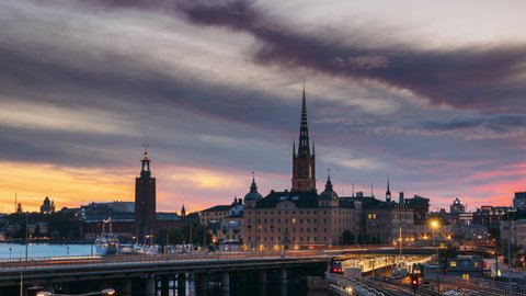 Stockholm, Sweden. Scenic View Of Stockholm Skyline At Summer Evening. Famous Popular Destination Scenic Place In Sunset Lights. Riddarholm Church, Subway Railway. Day To Night Transition Time Lapse