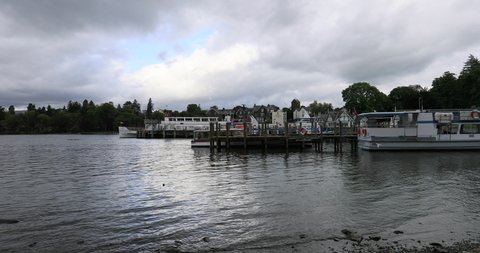 WINDERMERE, ENGLAND - 7 SEP 2019: Lake Windermere England Lake District boats marina. Historic vacation rural community. Northern England Lake District National Park. Tour, recreation and ferry boats.