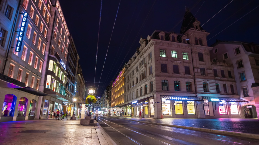 geneva city center night illumination main traffic street square panorama 4k timelapse switzerland