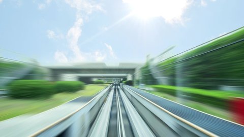 Future city transportation. An autonomous monorail train tracks and fast moving train in speed motion blur zoom effect