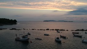 aerial view of boats in the sea on beautiful sunset