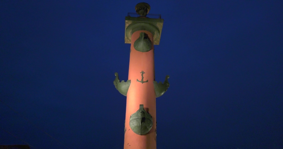 4K high quality dark night video of St.-Petersburg's beautiful vintage architecture illuminated Rastralnie columns beacons at Neva River in Vasilyevsky Island spit, Finnish Bay, Russia's northern capi
