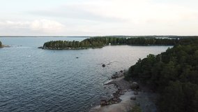 4K summer morning high quality video of Santalahti Baltic Sea Finnish Bay Resort, its pine tree forest walking path with granite boulders and old wild trees near Kotka, Finland Suomi, northern Europe