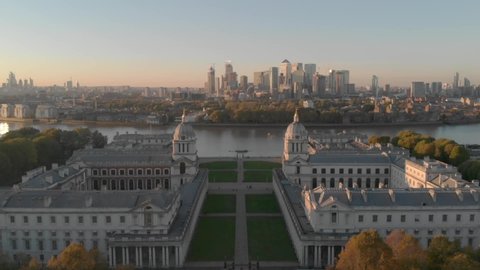 Drone over beautiful London city scape, Greenwich Maritime College and Canary Wharf.
