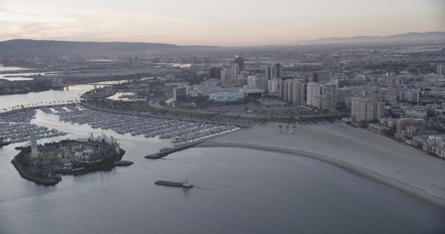Aerial shot, dusk, flyby and pan over downtown long beach, drone