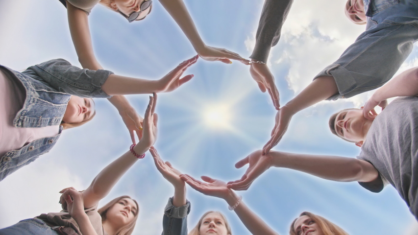 Conceptual symbol of cooperation diverse hands making a circle. Students help each other. Royalty-Free Stock Footage #1038399131