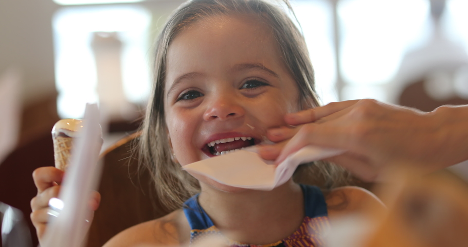 
Little girl eating ice cream cone | Shutterstock HD Video #1038401429