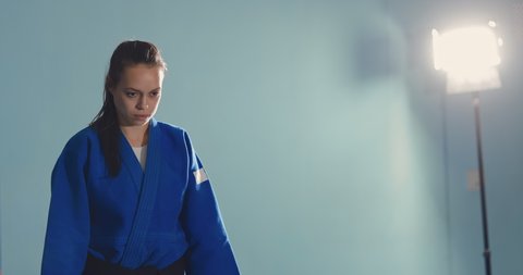 Greeting athletes before the fight. Girls tune into battle, serious look. Portrait view.