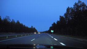 POV driving clip at night (dusk) in northern Sweden going south on the E4 highway from Lulea to Pitea.