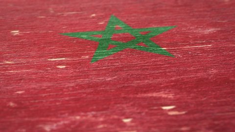Flag Of Morocco. Detail On Wood, Shallow Depth Of Field, Seamless Loop. High-Quality Animation. Ideal For Your Country / Travel / Political Related Projects. 1080p, 60fps.