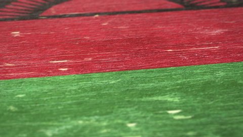 Flag Of Malawi. Detail On Wood, Shallow Depth Of Field, Seamless Loop. High-Quality Animation. Ideal For Your Country / Travel / Political Related Projects. 1080p, 60fps.