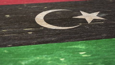 Flag Of Libya. Detail On Wood, Shallow Depth Of Field, Seamless Loop. High-Quality Animation. Ideal For Your Country / Travel / Political Related Projects. 1080p, 60fps.