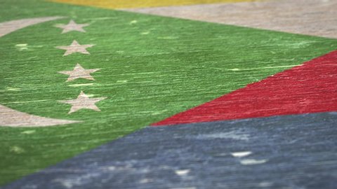 Flag Of Comoros. Detail On Wood, Shallow Depth Of Field, Seamless Loop. High-Quality Animation. Ideal For Your Country / Travel / Political Related Projects. 1080p, 60fps.