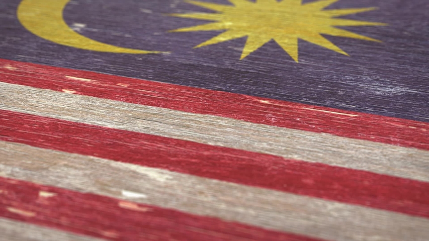 Flag Of Malaysia. Detail On Wood, Shallow Depth Of Field, Seamless Loop. High-Quality Animation. Ideal For Your Country / Travel / Political Related Projects. 1080p, 60fps.