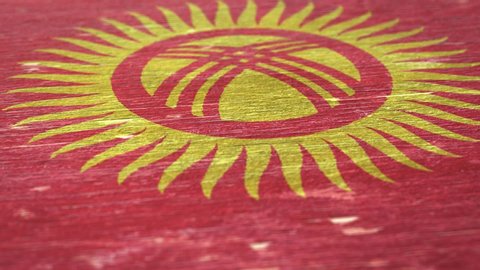 Flag Of Kyrgyzstan. Detail On Wood, Shallow Depth Of Field, Seamless Loop. High-Quality Animation. Ideal For Your Country / Travel / Political Related Projects. 1080p, 60fps.