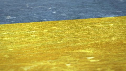 Flag Of Ukraine. Detail On Wood, Shallow Depth Of Field, Seamless Loop. High-Quality Animation. Ideal For Your Country / Travel / Political Related Projects. 1080p, 60fps.