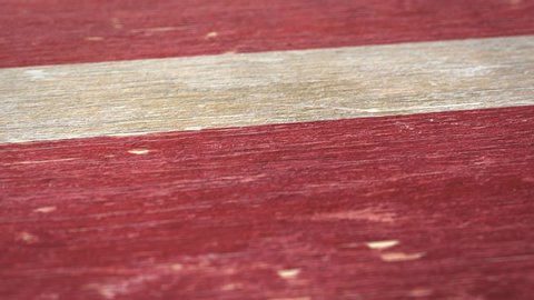 Flag Of Latvia. Detail On Wood, Shallow Depth Of Field, Seamless Loop. High-Quality Animation. Ideal For Your Country / Travel / Political Related Projects. 1080p, 60fps.