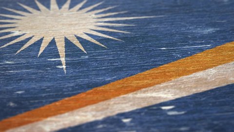 Flag Of The Marshall Islands. Detail On Wood, Shallow Depth Of Field, Seamless Loop. High-Quality Animation. Ideal For Your Country / Travel / Political Related Projects. 1080p, 60fps.