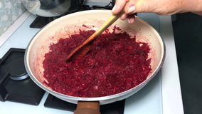 red radishes being fried in teflon pan Buy red vegetable dish 4K video shot