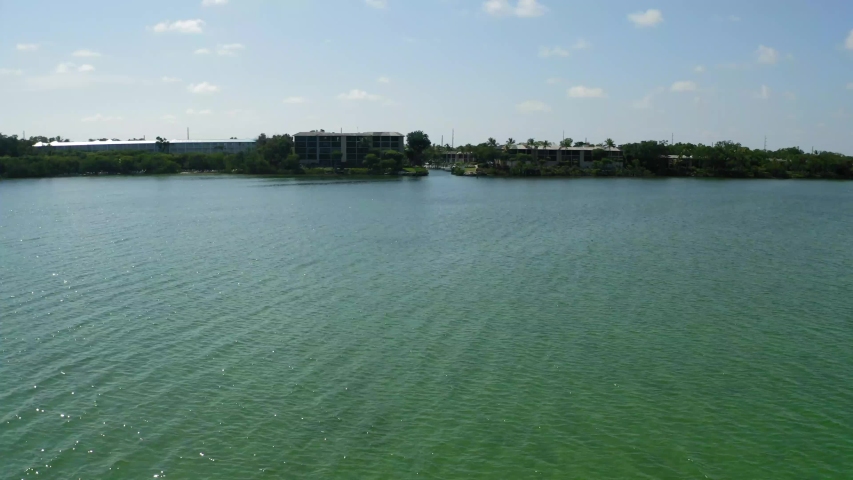 Aerial shot moving towards a coastal neighborhood