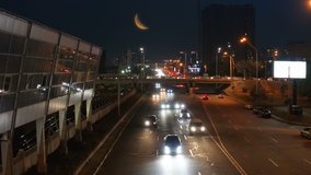 The Night Subway Station Traffic stock video is a gorgeous video clip that displays night drone aerial footage of a subway train leaving the station and many cars passing by the highway. With a huge m