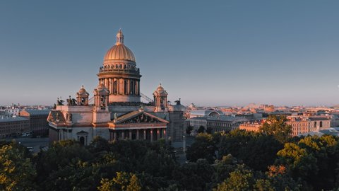 Summer morning view of Saint Isaac's Cathedral and threes of Alexander Garden in St.Petersburg and cultural center of city, Russia