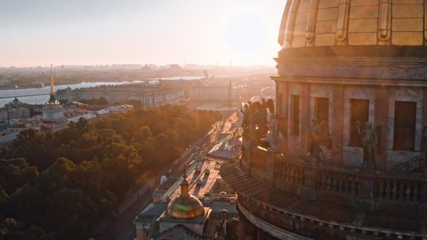 Sunny drone views of sculptures of angels on the colonnade of St. Isaac's Cathedral in Saint Petersburg, Russia