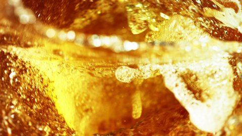 Super slow motion of pouring oil, cola or spirit drink in twister shape. Filmed on high speed cinema camera, 1000 fps.