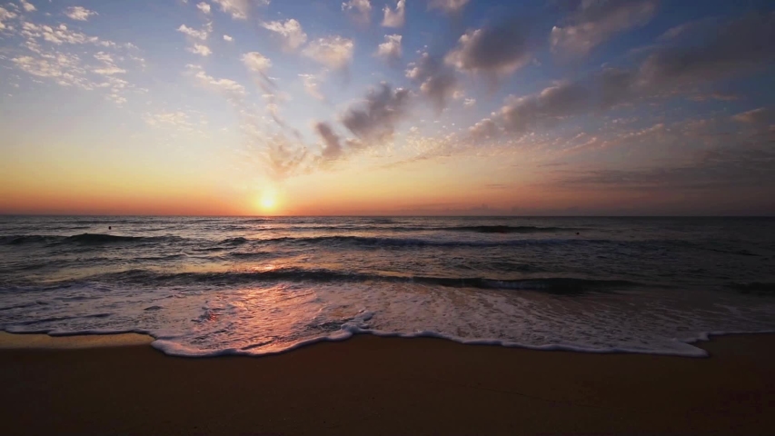 Orange colors sunrise and waves.  | Shutterstock HD Video #1038472076