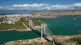 Aerial drone video of new famous public strait cable bridge of Halkida or Chalkida connecting mainland with Evoia island, Greece